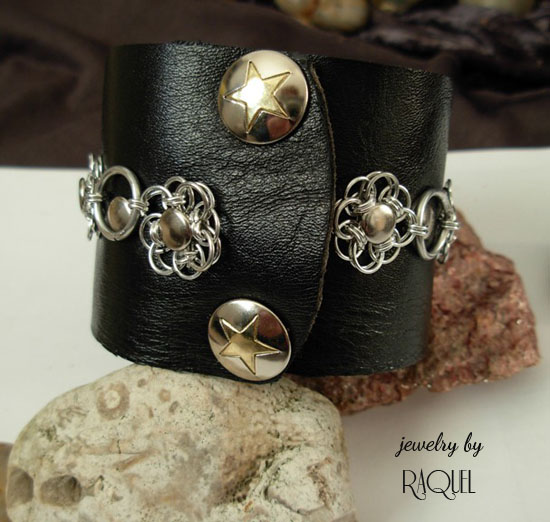 Black leather Rock N' Roll wrist band cuff with Flower scales